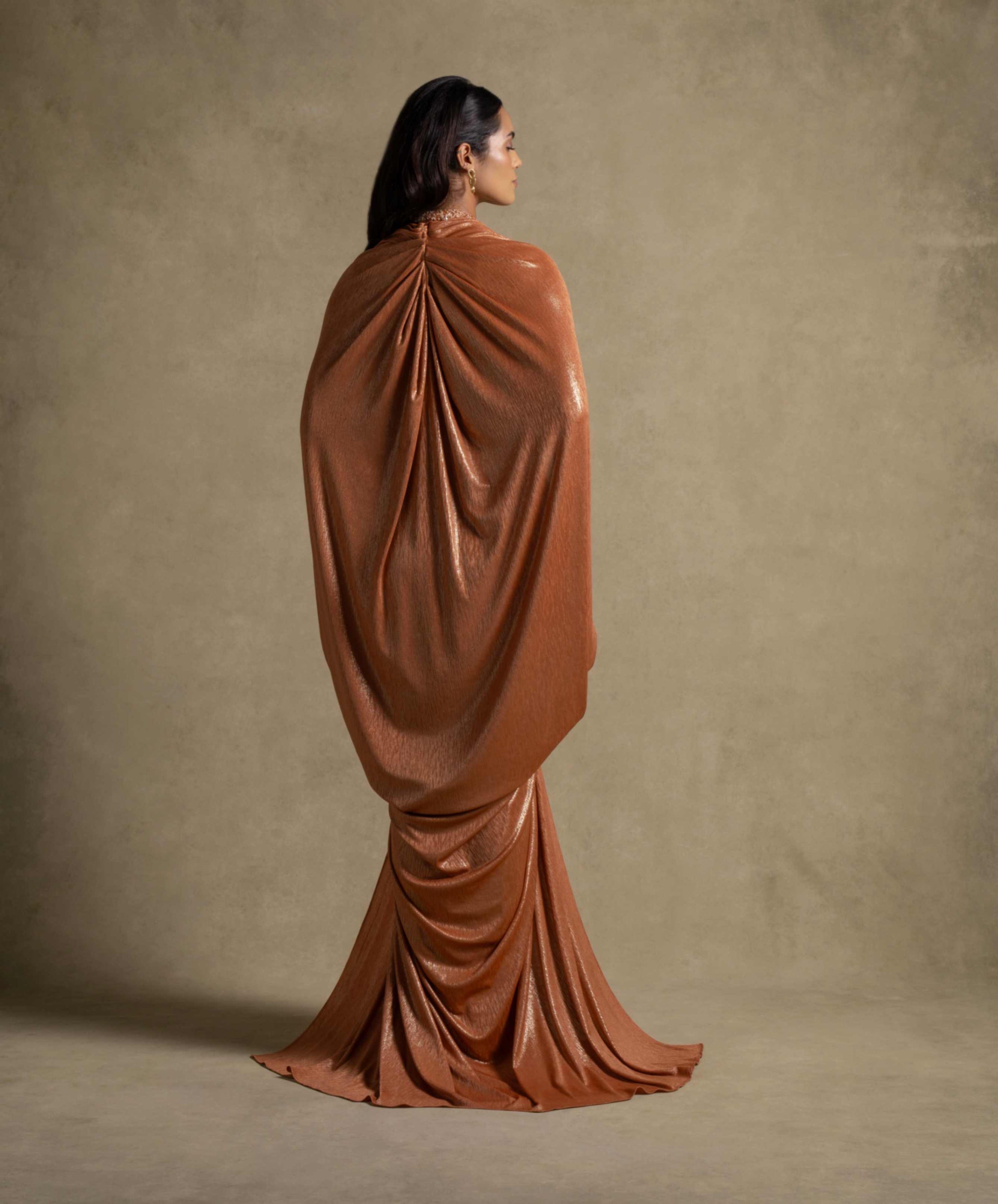 Moon Set gown in radiant Tangerine with flowing silhouette and shimmering foil finish, perfect for evening wear.