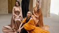 Artista Eid - AW 2025 women in elegant flowing dresses showcasing high-end luxury at Fashion Week.