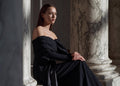 Elegant pastel gowns from the Pearl Collection SS24 in a serene setting.