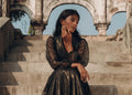 Esperanza Collection AW24 showcasing women in high-end luxury evening wear against a floral backdrop.