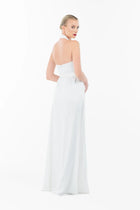 Back angle of the Ava Set Artista Ramadan 2025 white halter gown, showing its elegant flow and fitted waistline.