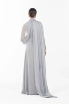 Back view of Rossettie Dress from Artista Eid - AW 2025 with long flowing chiffon cape and full-length satin gown, ideal for festive occasions.