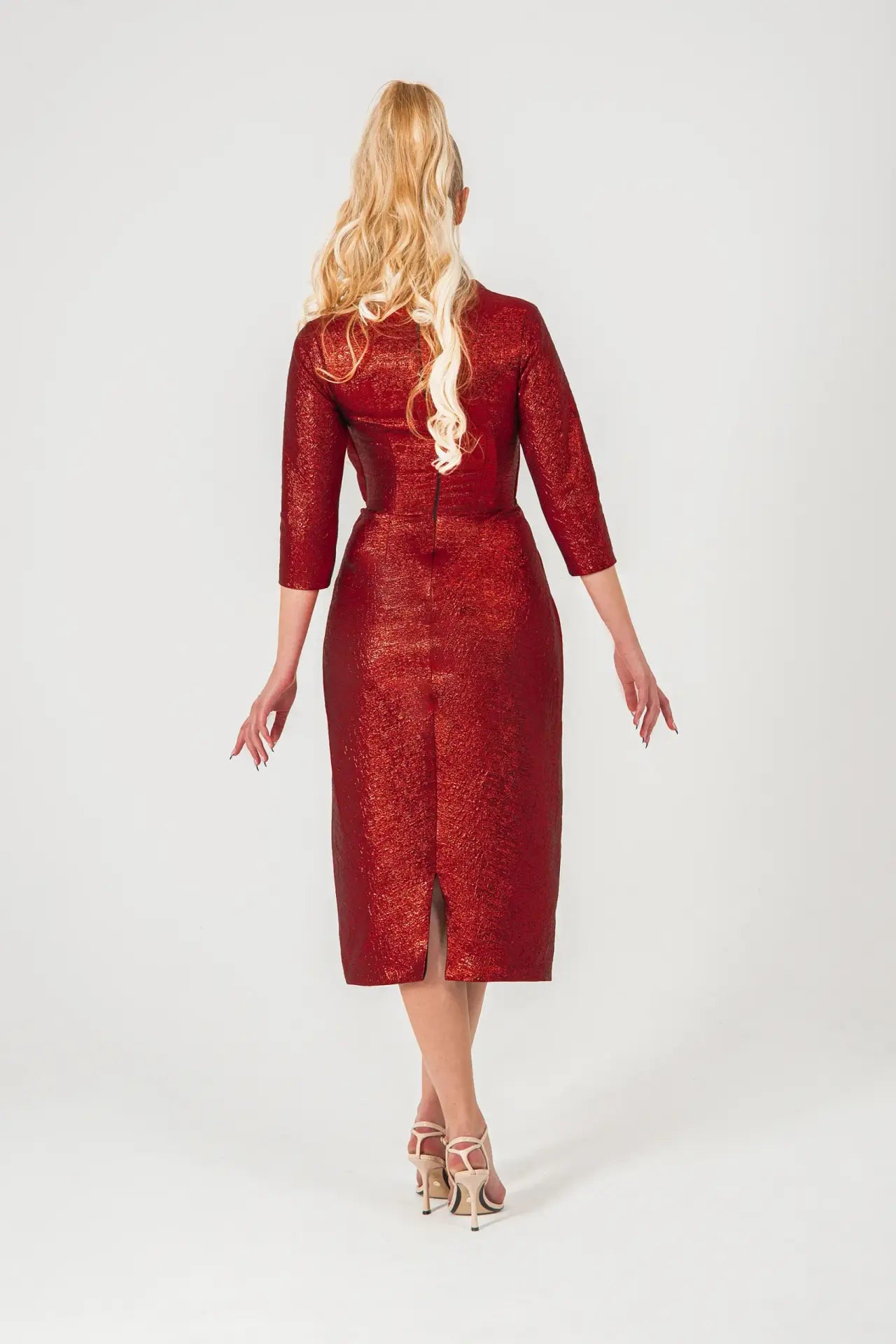 Back view of Volcano Dress - Red Brocade Dress with backzip closure and center slit, designed for elegance in STORM COLLECTION AW24.