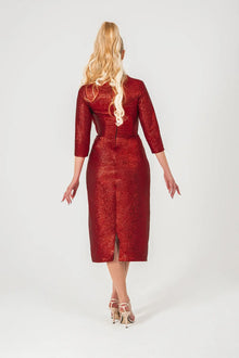Back view of Volcano Dress - Red Brocade Dress with backzip closure and center slit, designed for elegance in STORM COLLECTION AW24.