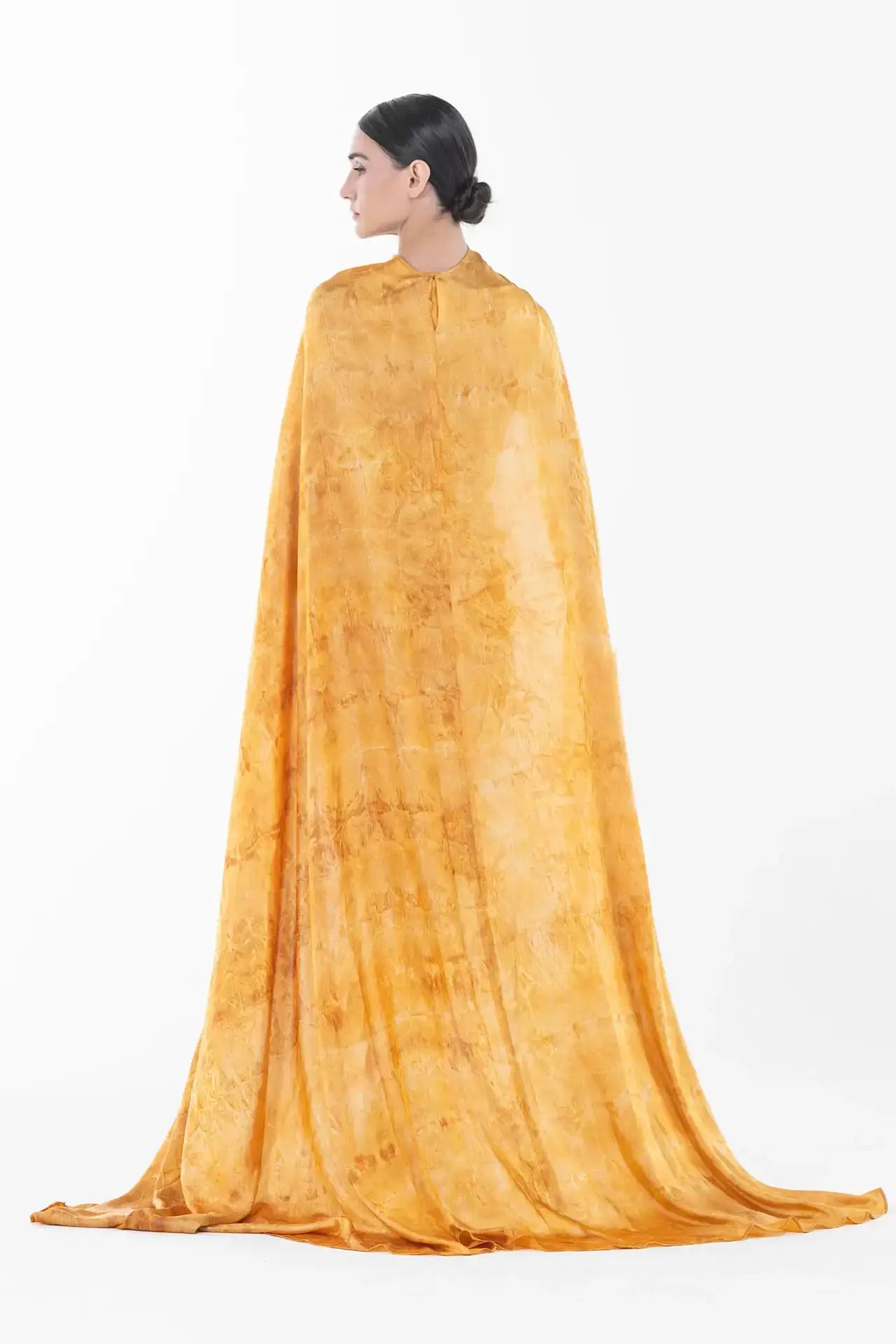 Back view of Helena Dress - Satin Gown | Formal Gown with Cape showcasing the full-length mustard cape with elegant draping and soft texture.