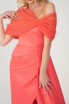 Close-up of Carolina Dress - Taffeta Tulle highlighting the intricate off-shoulder tulle wrap and structured bodice in vibrant tangerine.