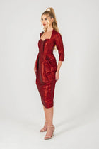 Side view of Volcano Dress - Red Brocade Dress featuring sculpted pleats and sweetheart neckline, part of STORM COLLECTION AW24.