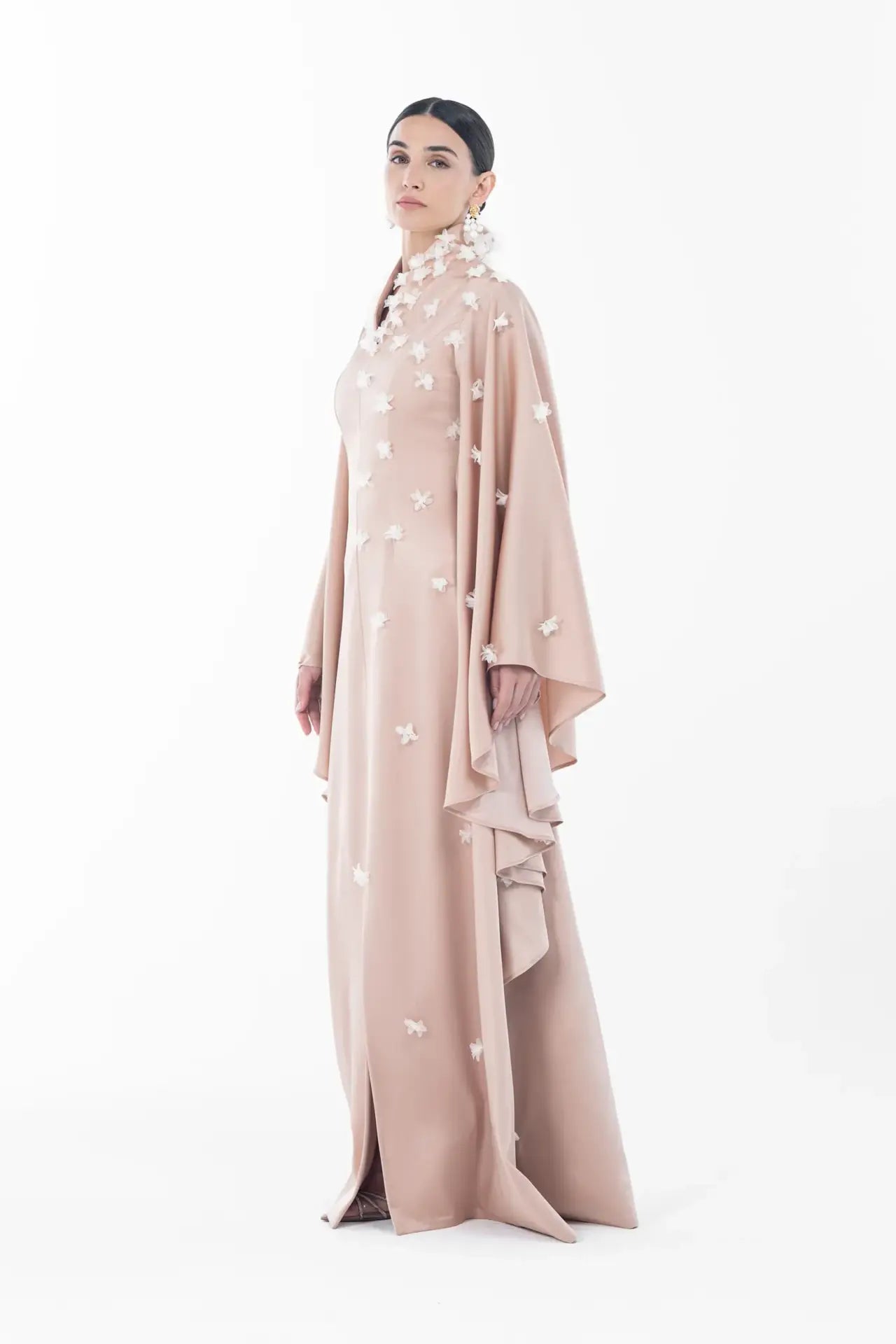 Three-quarter view of Artista Allure Dress with high-neck and floral details, designed for the Artista Eid - AW 2025 collection.