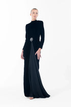 Black velvet Noir Dress with structured shoulders, ruched waist, and flowing drape, perfect for luxury black-tie events.