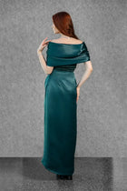 Back view of Maia Dress highlighting the smooth satin finish, off-shoulder wrap detail, and floor-length silhouette from Esperanza Collection AW24.