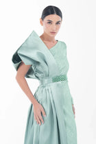 Detailed view of Boticelli Dress Mint Green highlighting the structured satin bow and intricate waist embellishment for formal wear.