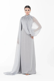 Elegant Rossettie Dress from Artista Eid - AW 2025 featuring a modest high neckline and sheer chiffon drape, perfect for formal Ramadan gatherings.