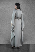 Back view of the Ella Dress - Satin Evening Gown with a defined waist and flowing cape-style sleeves, part of the Esperanza Collection AW24.
