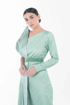Close-up of Boticelli Dress Mint Green showing textured fabric, beaded waist belt, and elegant one-shoulder design from Artista Eid - AW 2025 collection.