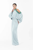 Side view of Ophelia Dress - Modern Silhouette Gown featuring draped satin fabric and elegant cold-shoulder design for Eid wear.