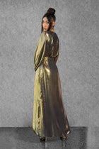 Back view of Hera Dress showcasing metallic gold silk-chiffon fabric and elegant draping from the Esperanza Collection AW24.