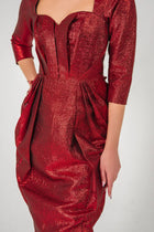 Close-up of Volcano Dress - Red Brocade Dress highlighting textured fabric, pleated bust, and tailored waist from STORM COLLECTION AW24.