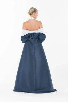 Rear view of Ava Set Artista Ramadan 2025 with the coat draped low, revealing the bare back of the halter gown.
