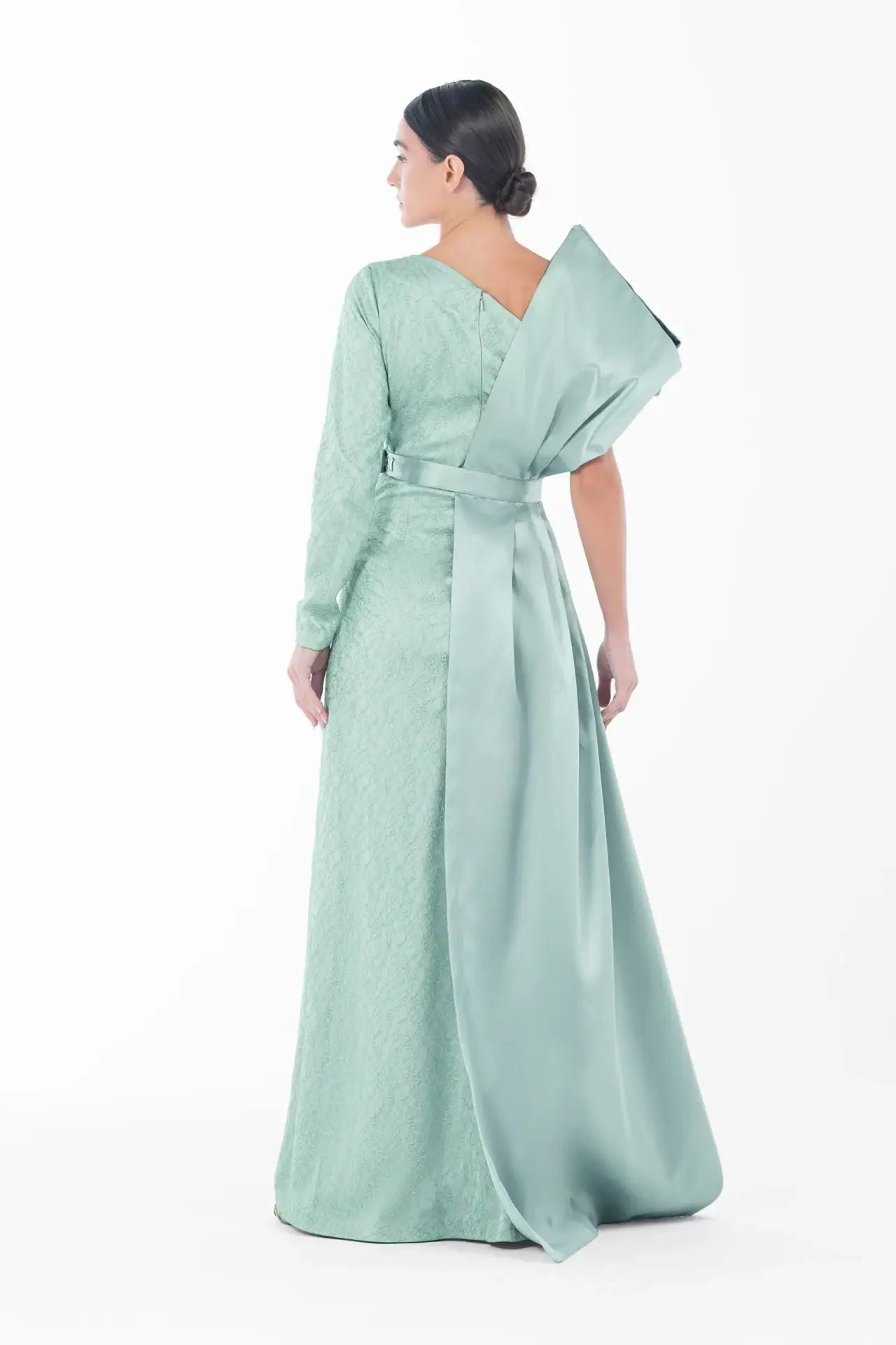 Rear angle of Boticelli Dress Mint Green with oversized satin bow and belt detail, combining luxury and modesty for festive wear.
