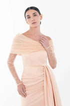 Close-up of Ispahan Dress from Artista Eid - AW 2025 featuring delicate lace sleeves and draped off-shoulder detail, perfect for formal occasions.