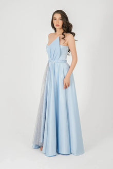 Side view of Diamond Dress Baby Blue with one-shoulder neckline and flared skirt, revealing the layered chiffon and lace fabric blend.