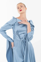 Model poses in Cinderella Dress - Elegant Gown with ruched satin sleeves and a sculpted waist, ideal for evening elegance.