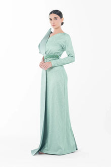 Side profile of Boticelli Dress Mint Green featuring long sleeves, fitted bodice, and elegant floor-length silhouette for Eid celebrations.