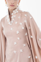 Detailed view of Artista Allure Dress bodice with high-neck and delicate white floral accents, perfect for formal Eid gatherings.