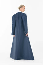 Back view of the navy oversized coat from Ava Set Artista Ramadan 2025, tailored in mikado satin for a regal silhouette.