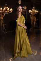 Side view of Ambre Dress - Olive Green One-Shoulder satin gown with flowing cape and cinched waist, perfect for upscale formal occasions.