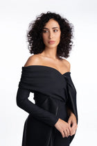 Close-up of Ruby Jumpsuit - Formal Wear with elegant off-shoulder draping and structured bodice, part of the Pearl Collection SS24.