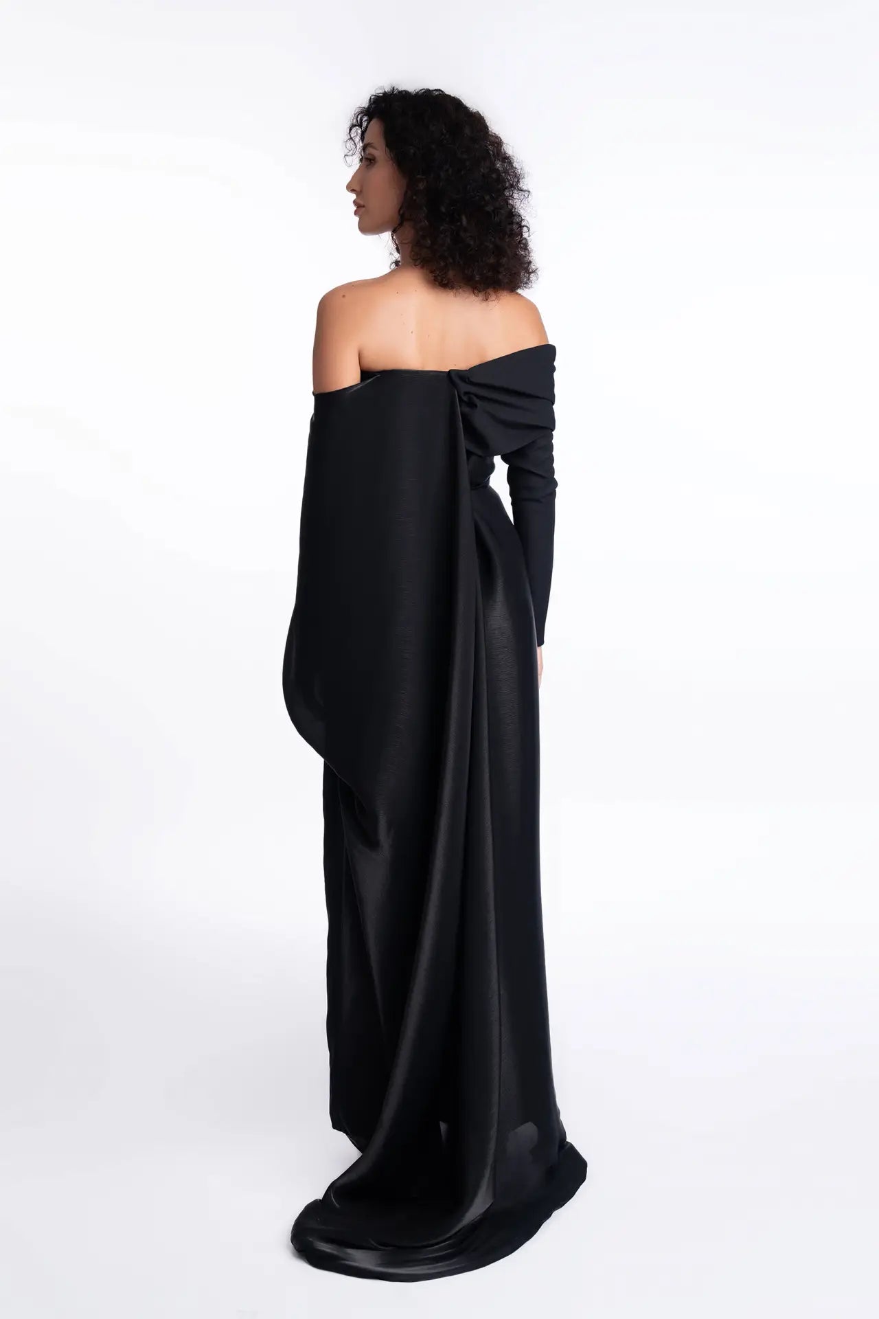 Back view of Ruby Jumpsuit - Formal Wear highlighting dramatic silk organza train and off-shoulder design from Pearl Collection SS24.