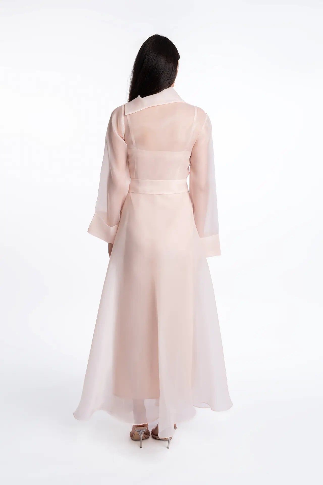 Back view of the Azalea Bella Dress, highlighting the flowing A-line silhouette and sheer organza fabric from the Esperanza Collection AW24.