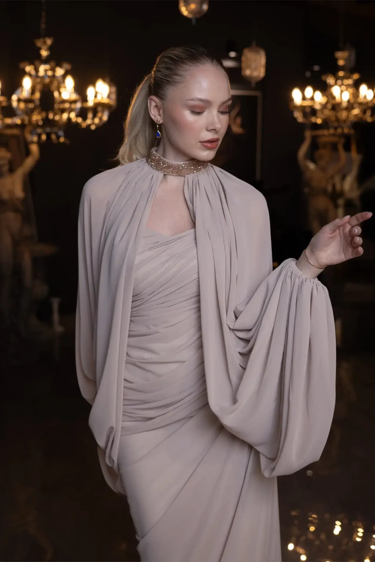 Front detail of Elora Dress - Beige Chiffon Elegance showing gathered chiffon layers and a crystal-embellished neckline for a regal look.