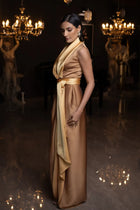 Side view of Kelly Set dress in golden mustard satin with draped neckline and belted waist, perfect for elegant events.