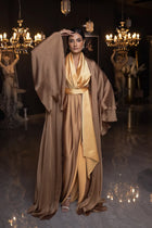 Verite Majestique PF2025 Kelly Set featuring a golden mustard sleeveless gown and dramatic cape, ideal for evening wear.