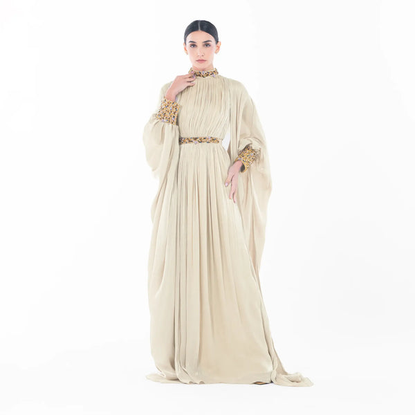 Mademoiselle Set, an ivory high-neck gown with embellished cuffs and flowing silhouette, perfect for evening wear.