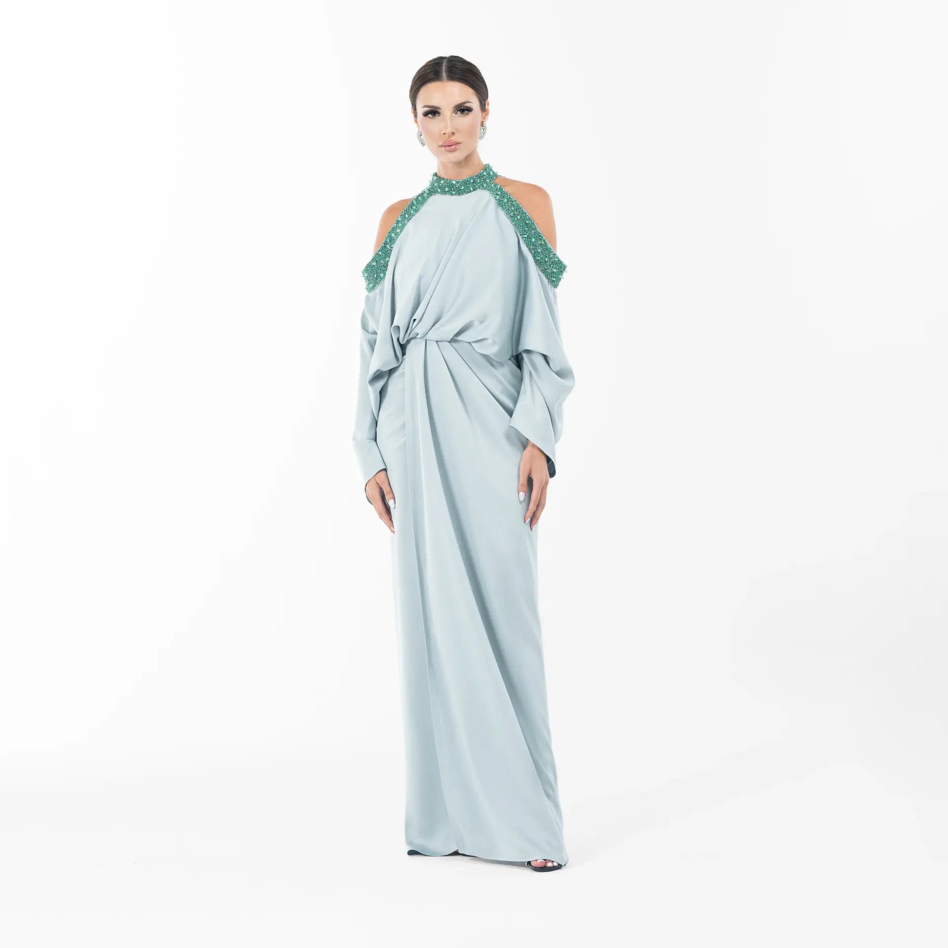 Ophelia Dress - Ramadan Collection gown in seafoam green satin with cold-shoulder cut and green embellished neckline, front view.