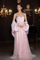 Blush-toned Miss Waad Dress with intricate embellishments, sheer tulle overlay, and dramatic cape, part of Verite Majestique PF2025 collection.