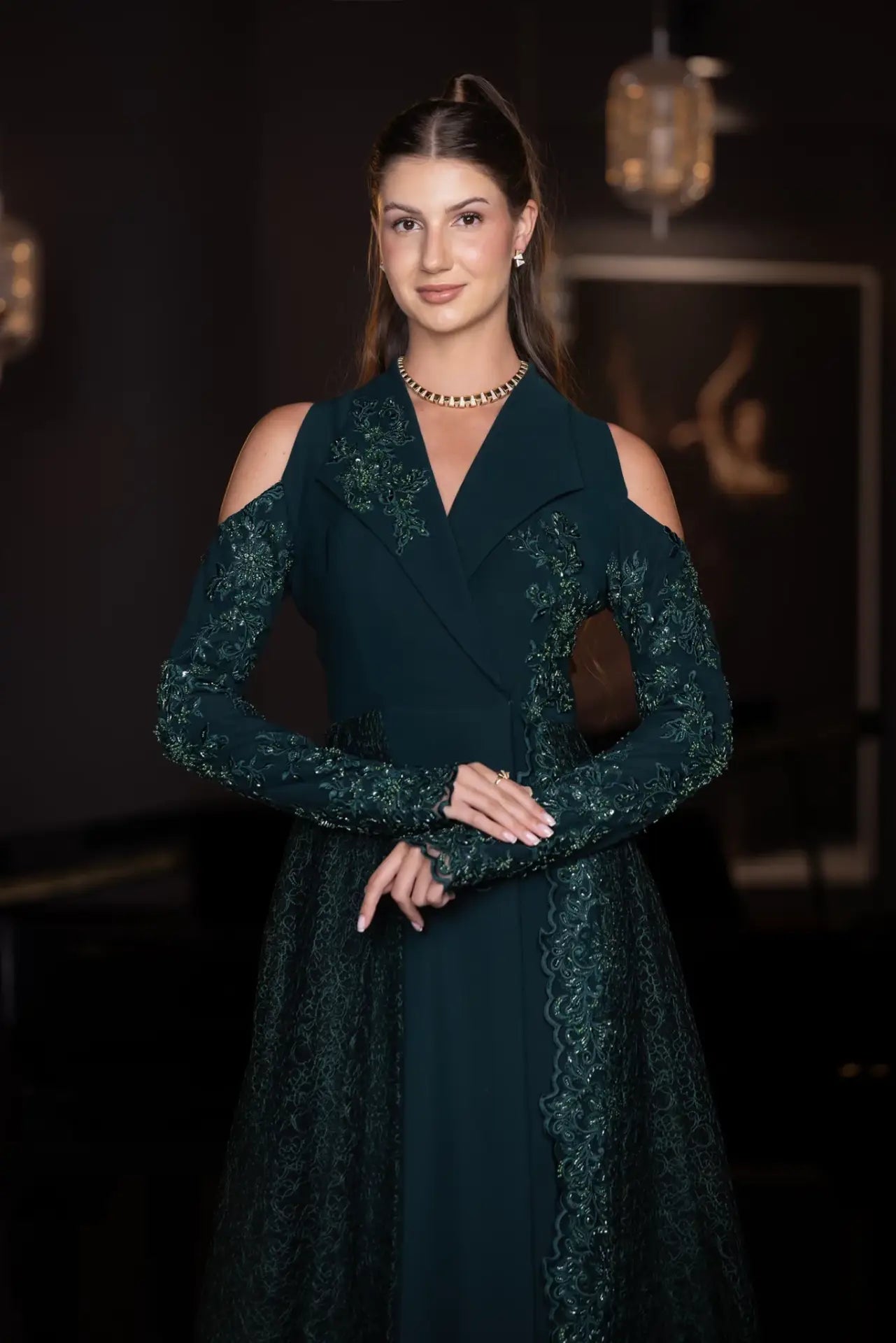 Close-up of the Pochette Dress from Verite Majestique PF2025, highlighting lace embellishments, crepe fabric, and cold-shoulder design.