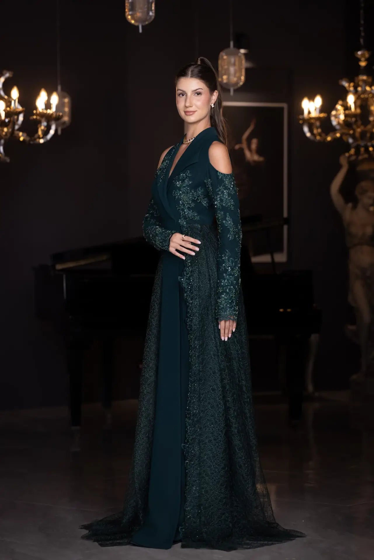 Side profile of the Pochette Dress - Emerald Green | Structured Silhouette, showcasing detailed embroidery and elegant fit from PF2025 line.