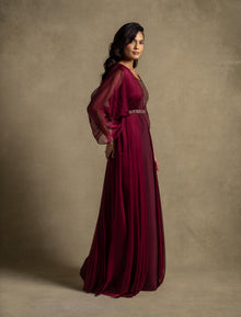 Burgaya Dress showcasing a maroon maxi dress with pleated chiffon overlay and beaded accents, perfect for evening wear.