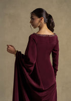 Roxana Dress: Elegant maroon gown from the Zarina Collection featuring draped detailing and embellished neckline.