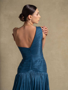 Layali Dress back view showcasing the turquoise gown's ruched bodice and elegant flowing skirt. High end fashion evening wear.