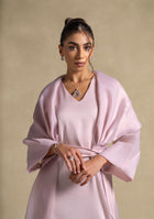 Isis Set worn by a model featuring luxurious pink quartz fabric and elegant shawl, representing high-end women's fashion.