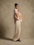 Selene Set model showcasing a luxurious beige satin gown and elegant pink shimmering cape for high-end fashion evening wear.
