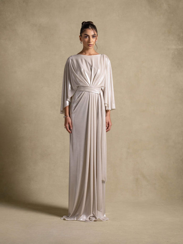 Serena Dress, a luxurious silver maxi dress featuring wide sleeves and a cinched waist, perfect for evening wear.