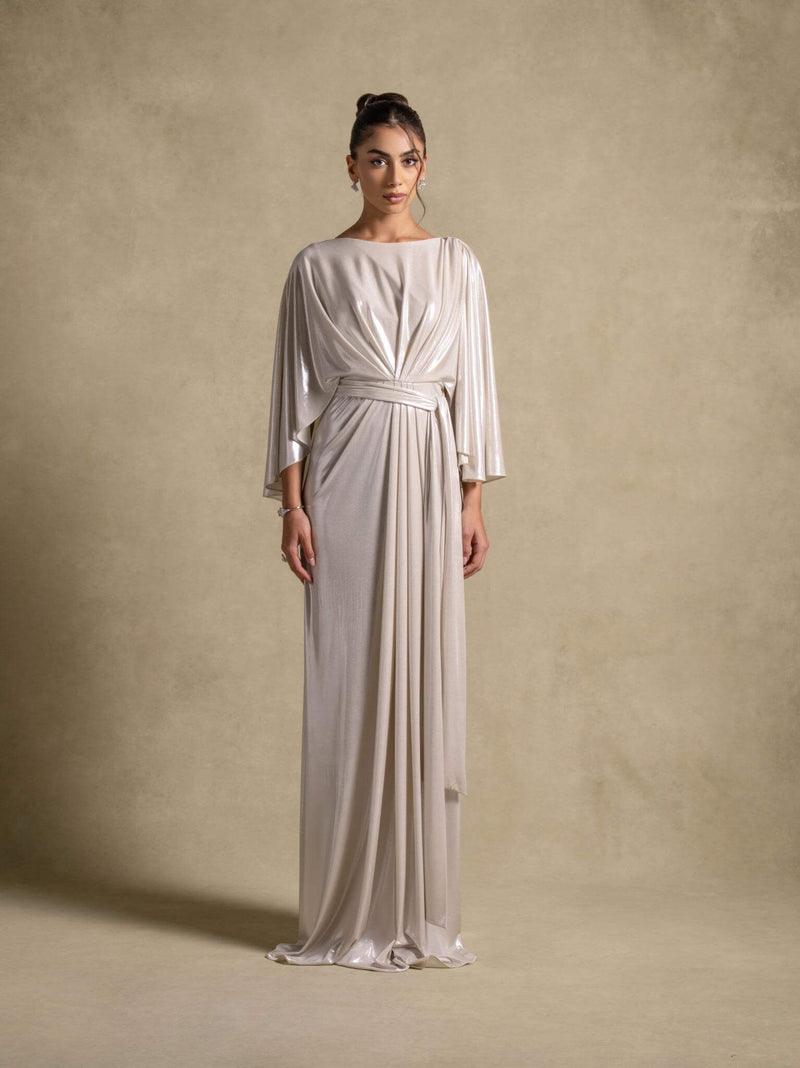 Serena Dress, a luxurious silver maxi dress featuring wide sleeves and a cinched waist, perfect for evening wear.