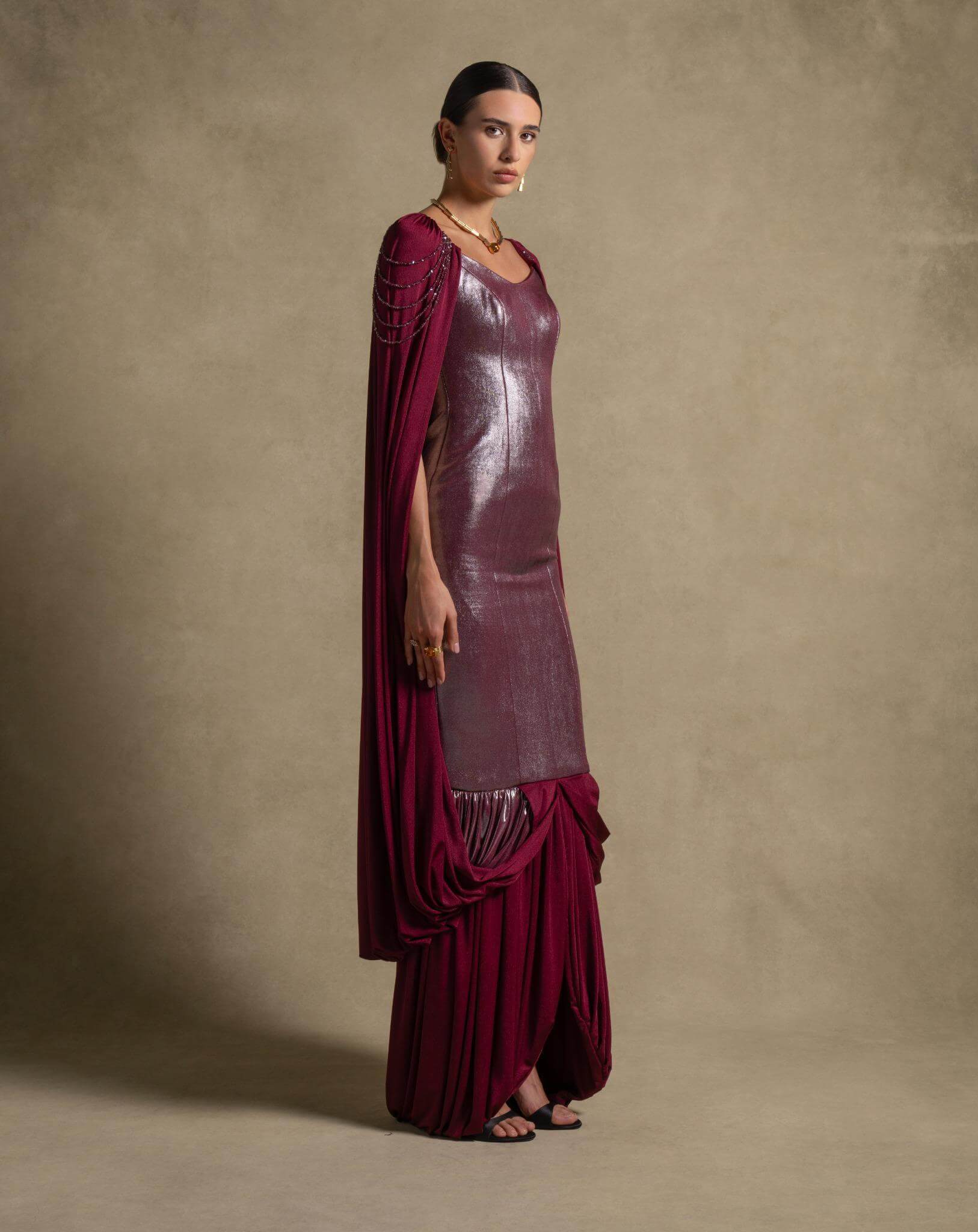 Vionna Dress in deep maroon with metallic bodice and draped jersey panels, perfect for luxury evening wear.