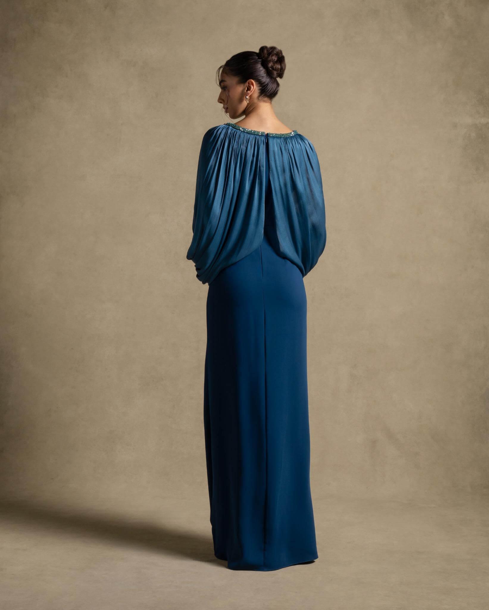 Zoe Dress in turquoise with pleated organza drape and voluminous sleeves, perfect for evening wear and luxury fashion.